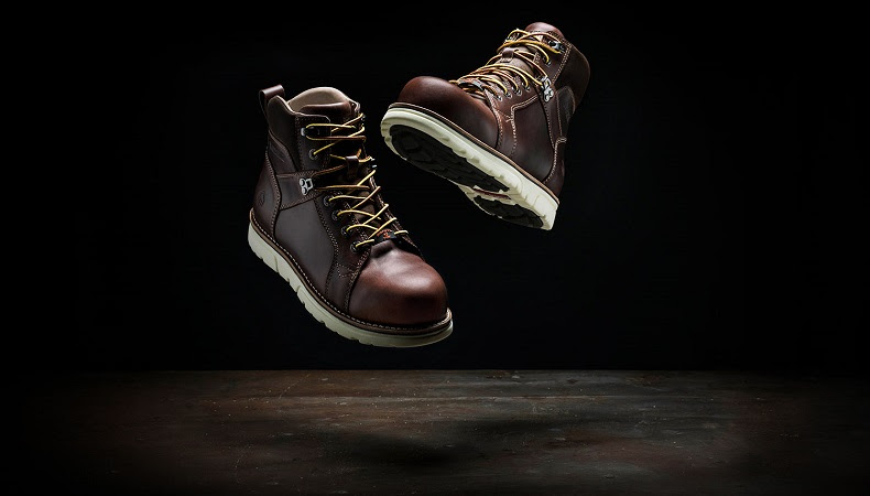 a picuter of wolverine boots on a black background